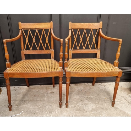 1089 - A pair of early 19th century beech and cane open armchairs, possibly Scandinavian.