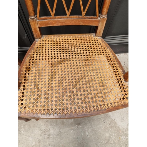 1089 - A pair of early 19th century beech and cane open armchairs, possibly Scandinavian.