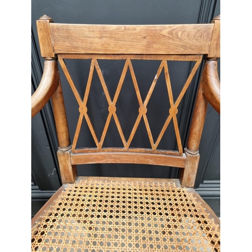 1089 - A pair of early 19th century beech and cane open armchairs, possibly Scandinavian.