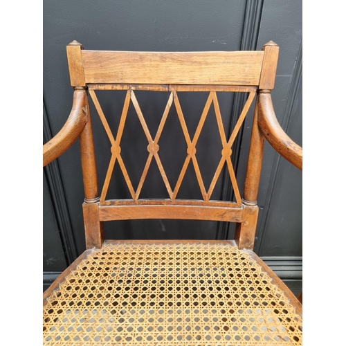 1089 - A pair of early 19th century beech and cane open armchairs, possibly Scandinavian.