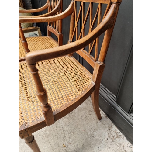 1089 - A pair of early 19th century beech and cane open armchairs, possibly Scandinavian.