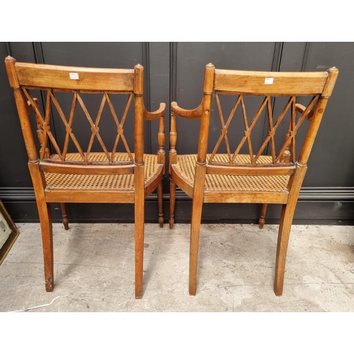 1089 - A pair of early 19th century beech and cane open armchairs, possibly Scandinavian.