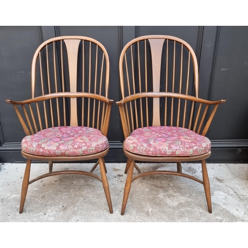 1092 - A pair of Ercol Windsor armchairs, gold stickers. 