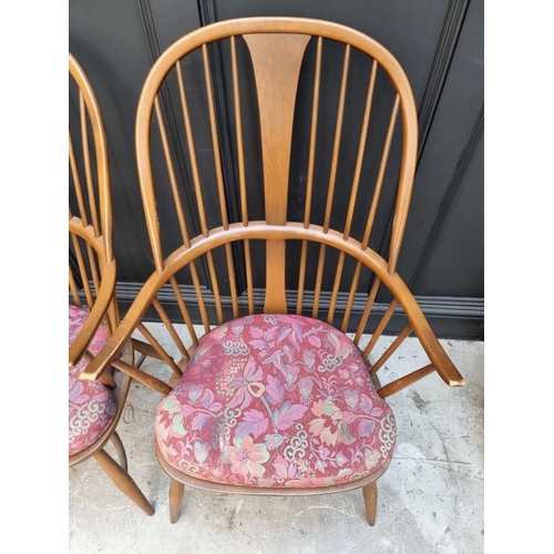 1092 - A pair of Ercol Windsor armchairs, gold stickers. 