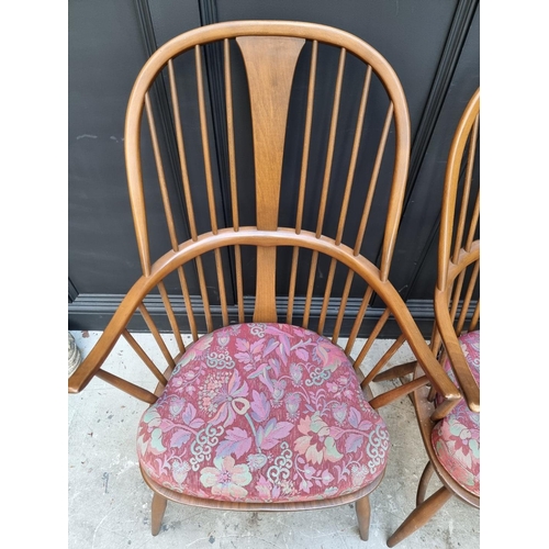 1092 - A pair of Ercol Windsor armchairs, gold stickers. 