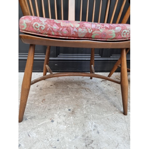 1092 - A pair of Ercol Windsor armchairs, gold stickers. 