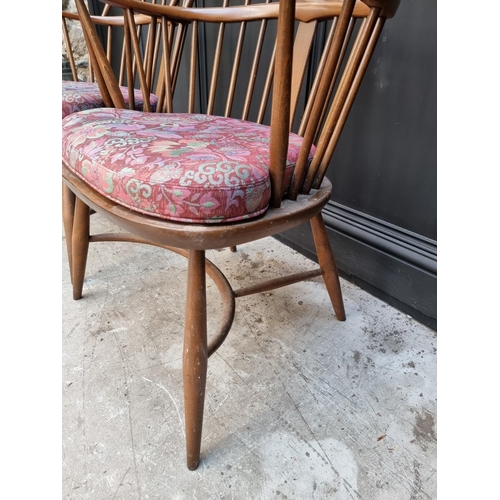 1092 - A pair of Ercol Windsor armchairs, gold stickers. 