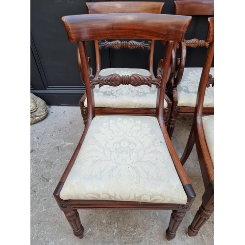 1093 - A set of four George IV mahogany bar back dining chairs, to include a pair of elbow chairs. ... 