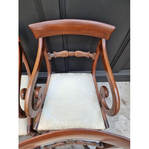 1093 - A set of four George IV mahogany bar back dining chairs, to include a pair of elbow chairs. ... 