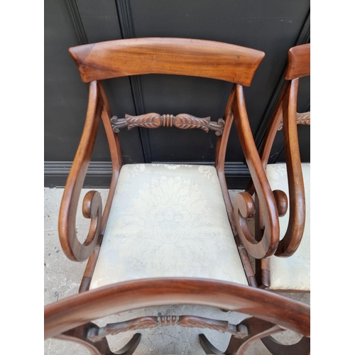 1093 - A set of four George IV mahogany bar back dining chairs, to include a pair of elbow chairs. ... 