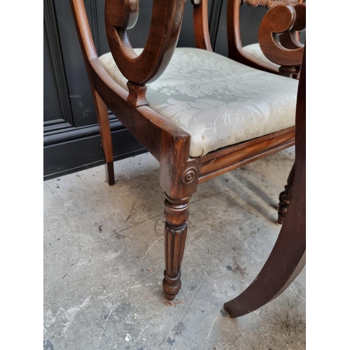 1093 - A set of four George IV mahogany bar back dining chairs, to include a pair of elbow chairs. ... 