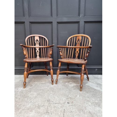 1095 - A pair of old ash, elm and fruitwood Windsor armchairs, each stamped 'CB'. 