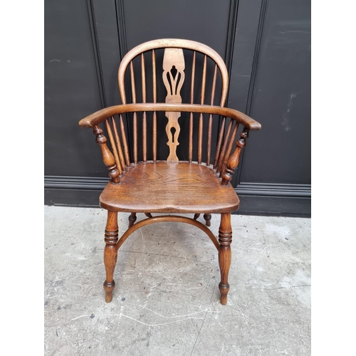 1095 - A pair of old ash, elm and fruitwood Windsor armchairs, each stamped 'CB'. 