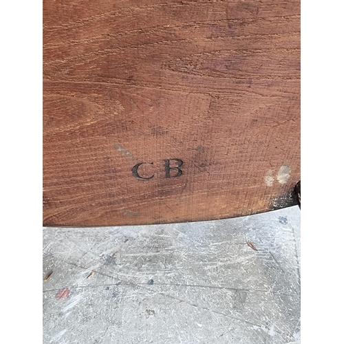 1095 - A pair of old ash, elm and fruitwood Windsor armchairs, each stamped 'CB'. 