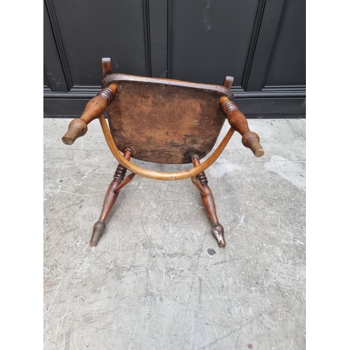 1095 - A pair of old ash, elm and fruitwood Windsor armchairs, each stamped 'CB'. 