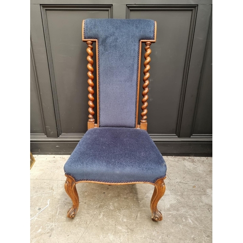 1097 - A Victorian walnut and upholstered prie dieu chair.  