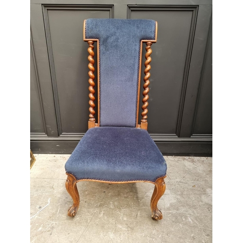 1097 - A Victorian walnut and upholstered prie dieu chair.  