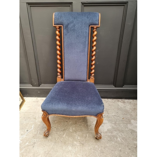 1097 - A Victorian walnut and upholstered prie dieu chair.  