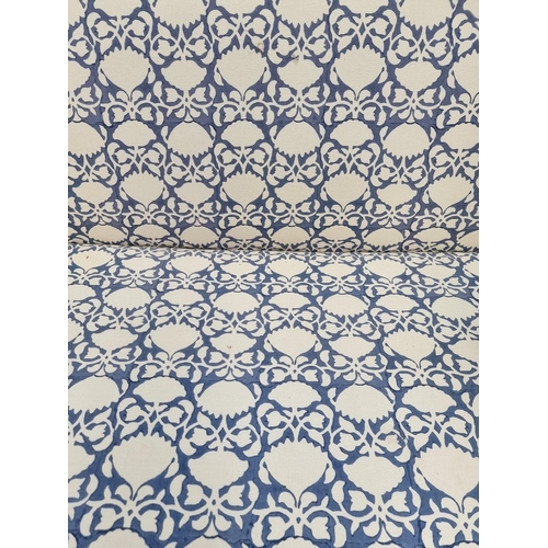 1099 - A contemporary blue and white upholstered settee, 175cm wide. 