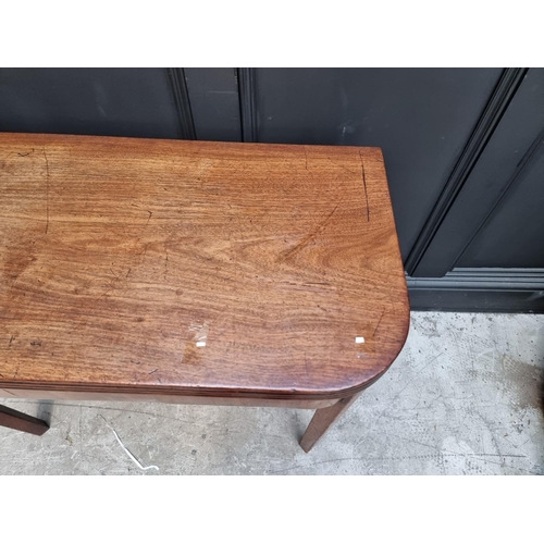 1103 - A George III mahogany tea table, with double gateleg action, 91cm wide, (s.d.).