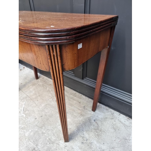 1103 - A George III mahogany tea table, with double gateleg action, 91cm wide, (s.d.).