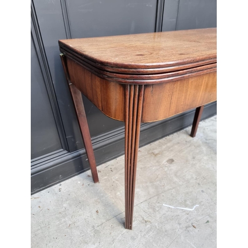 1103 - A George III mahogany tea table, with double gateleg action, 91cm wide, (s.d.).