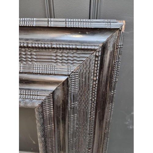 1105 - An antique Dutch ebonized ripple moulded frame, the whole 101 x 87.5cm, rebate 57.5cm x 46cm.... 