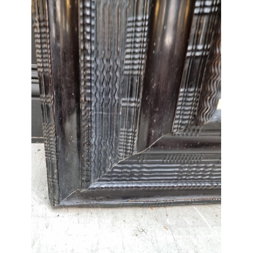 1105 - An antique Dutch ebonized ripple moulded frame, the whole 101 x 87.5cm, rebate 57.5cm x 46cm.... 