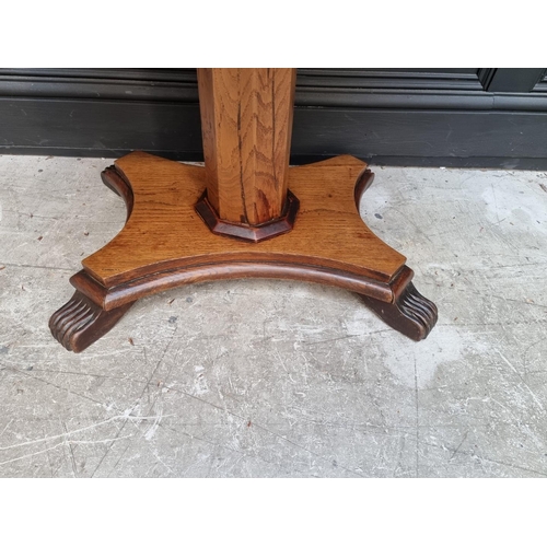 1107 - An oak and parquetry rectangular pedestal table, 83.5cm wide. 