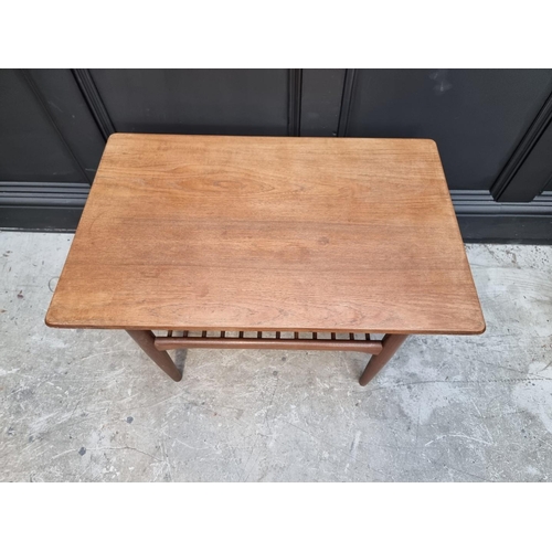 1109 - A G Plan rectangular low occasional table, with spindle undertier, 76cm wide.