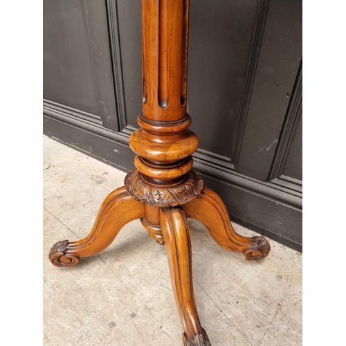 1113 - A Victorian carved walnut pedestal occasional table, 49cm wide. 