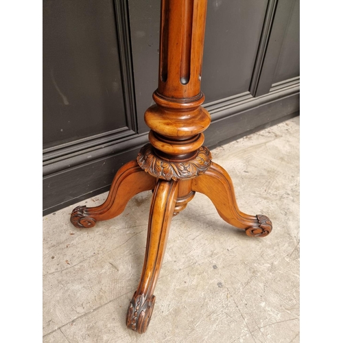 1113 - A Victorian carved walnut pedestal occasional table, 49cm wide. 