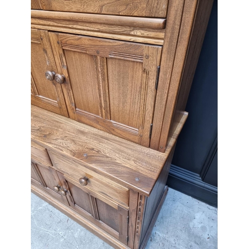 1119 - An Ercol elm bookcase, 96cm wide.