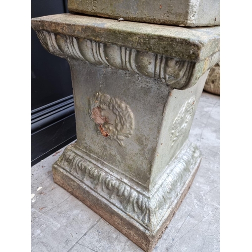 1134 - An old silver painted composition stone urn and pedestal, with ivy leaf relief decoration, 115cm hig... 