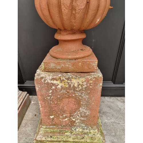 1136 - A large pair of red painted composition stone Campana urns and pedestals, total height 128cm.&n... 