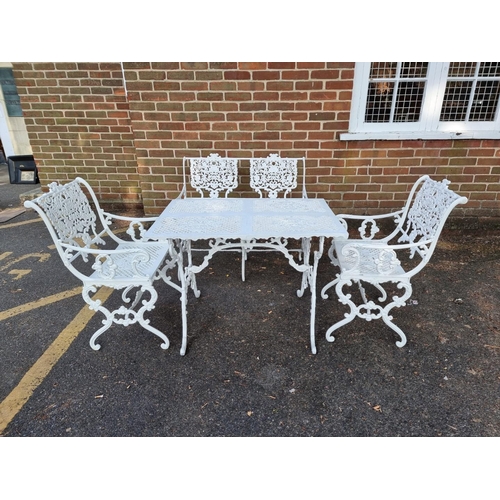 1138 - A Victorian style white painted aluminium garden suite, comprising: a table, 93.5cm wide; a two seat... 