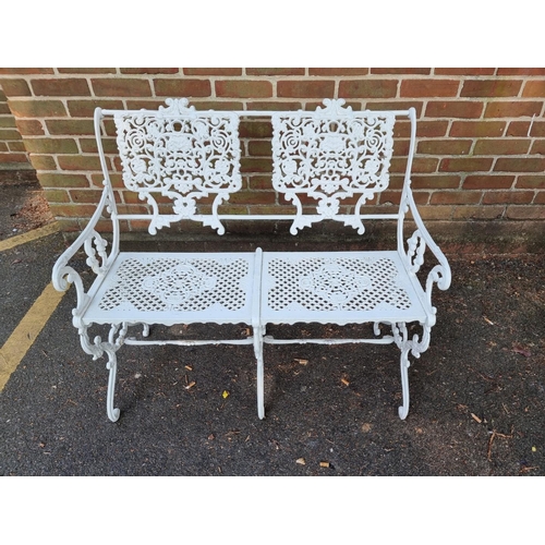 1138 - A Victorian style white painted aluminium garden suite, comprising: a table, 93.5cm wide; a two seat... 