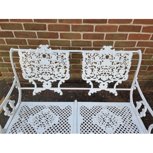 1138 - A Victorian style white painted aluminium garden suite, comprising: a table, 93.5cm wide; a two seat... 