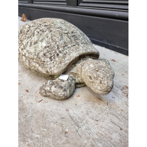 1141 - A weathered composition stone tortoise, 49cm long; and a similar pig, 40cm long. (2)... 