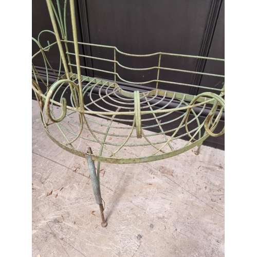 1144 - An old green painted wirework demi-lune two-tier plant stand, 110cm high x 74.5cm wide.... 