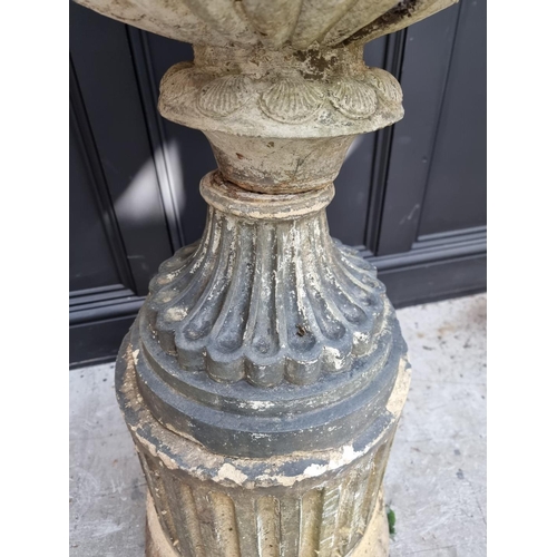 1145 - An old weathered pottery or composition stone Campana urn and pedestal, 111cm high, (s.d.).... 