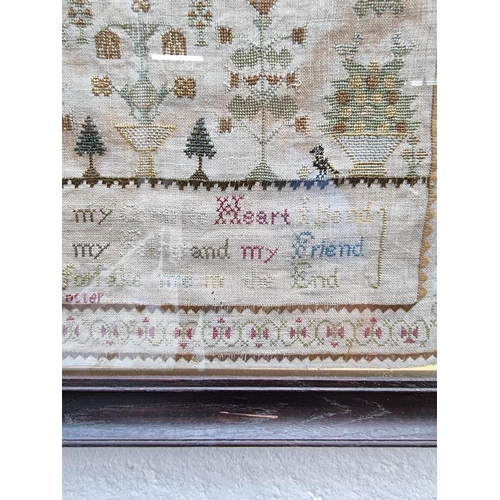 1300 - A 19th century needlework sampler, by 'Ann Foster', 44 x 36cm.