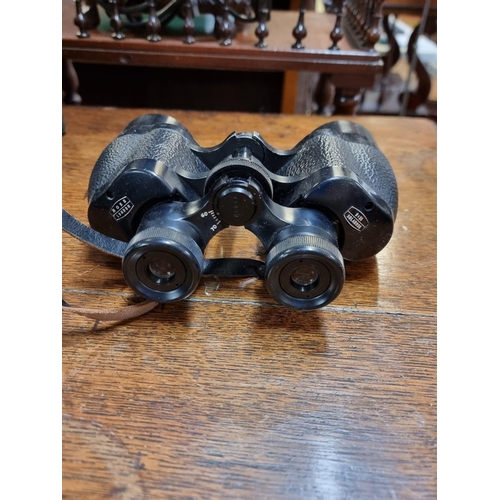 1319 - A pair of Ross 9x35 binoculars, cased; together with two other pairs of binoculars; and two pairs of... 