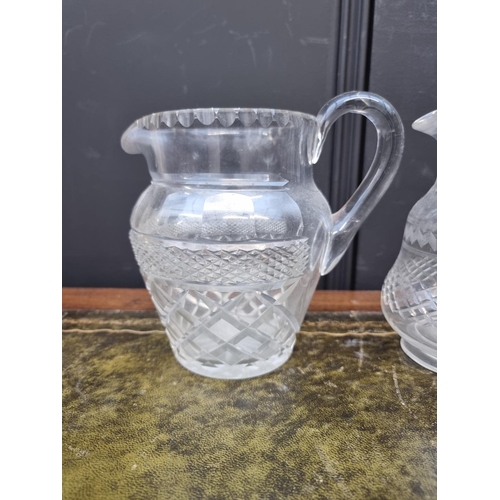 1357 - Three 19th century cut glass jugs, largest 18.5cm high. (3)