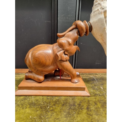 1393 - An unusual Indian hardwood elephant and shell table lamp, 37.5cm high. 