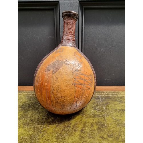 1394 - Ethnographica: a Central American gourd rattle, 33cm high.