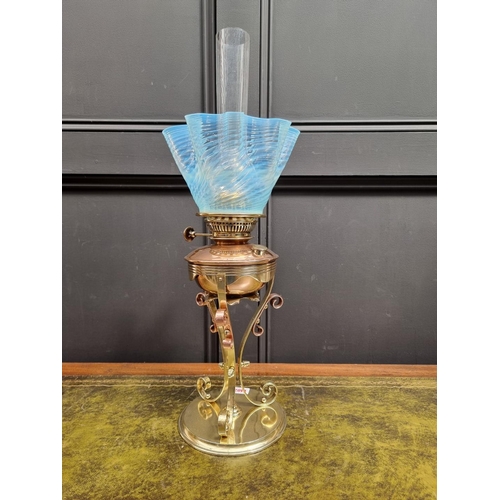 1402 - An Art Nouveau copper and brass oil lamp, in the manner of WAS Benson, with Vaseline glass shade, he... 