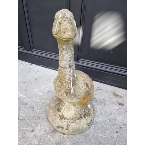 1147 - An old weathered composition stone goose, 63.5cm high, (repaired). 