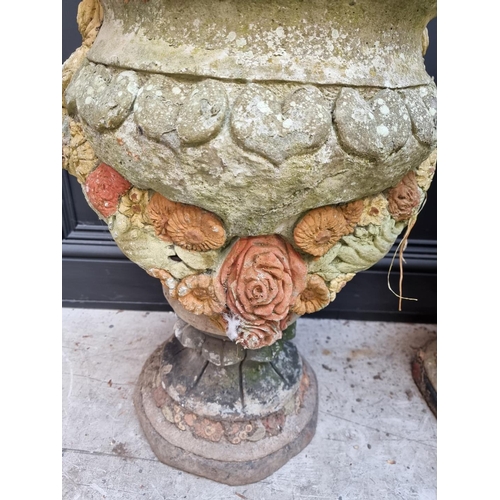 1148 - A pair of composition stone garden planters, 64cm high. 