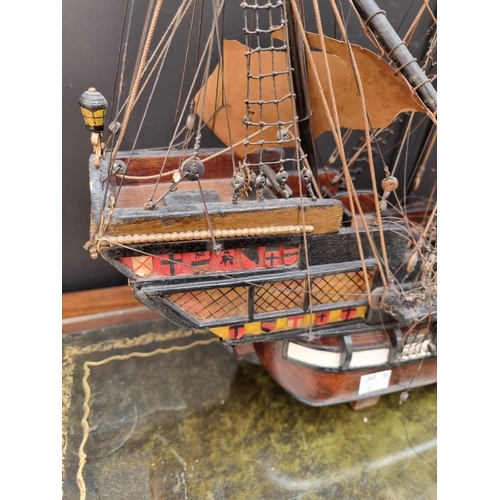 1178 - A painted wood model galleon, 70cm long, on wood stand. 